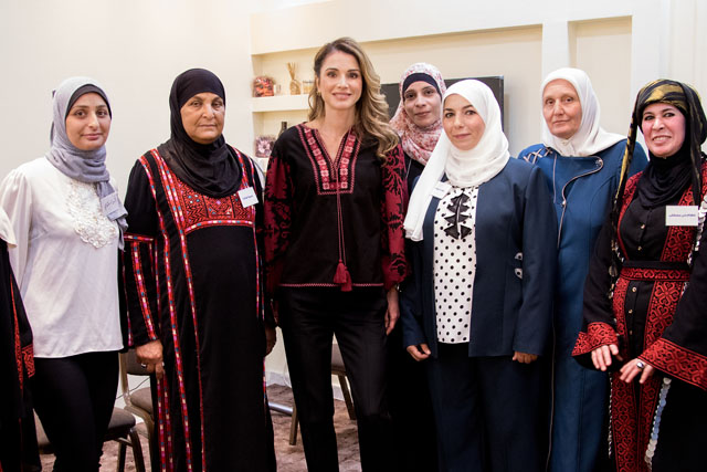 Her Majesty Queen Rania poses for a group photo with members of the Jordan Association for Human Development in Jerash on Thursday (Photo courtesy of Royal Court)